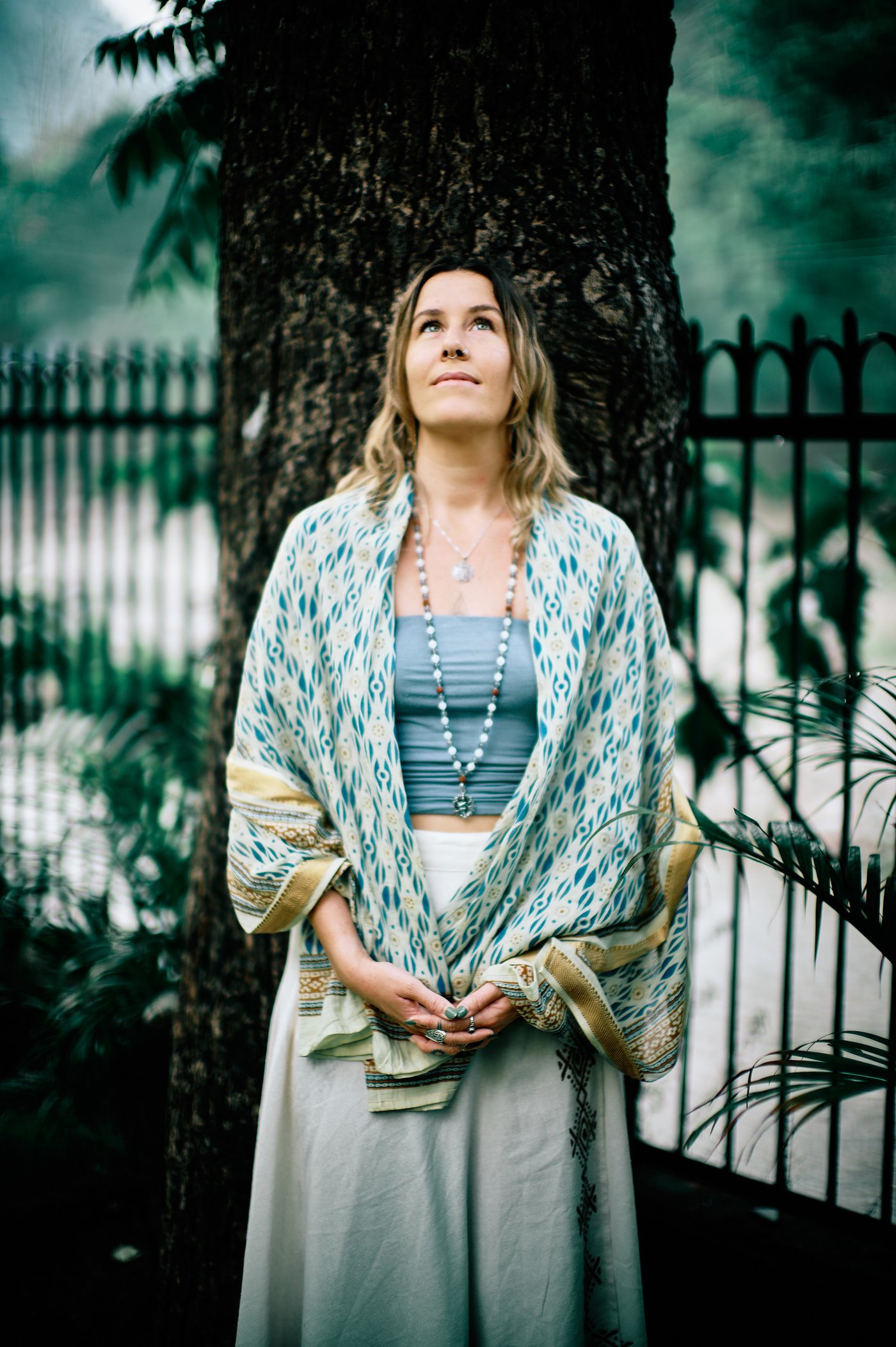 Cassidy standing peacefully beneath a large tree